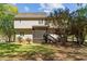 Two-story home with neutral siding, a screened-in porch, and a well-maintained backyard at 720 Raymond Dr, Clayton, NC 27527
