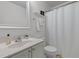 A light and airy bathroom featuring a single sink vanity and a shower with curtain at 720 Raymond Dr, Clayton, NC 27527