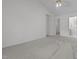 Light-filled bedroom featuring neutral carpet, closet, and an en suite bathroom at 720 Raymond Dr, Clayton, NC 27527