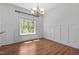 A bright dining room features a large window with natural light and classic wainscoting at 720 Raymond Dr, Clayton, NC 27527