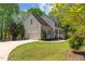Charming two-story home with attached garage and manicured lawn at 720 Raymond Dr, Clayton, NC 27527