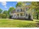 Charming two-story home with a welcoming front porch and well-manicured lawn at 720 Raymond Dr, Clayton, NC 27527