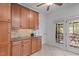 Kitchen with lots of cabinet space, tile floors, and access to the screened porch at 720 Raymond Dr, Clayton, NC 27527