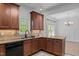 Elegant kitchen with granite countertops, black appliances, tile backsplash and wood cabinetry at 720 Raymond Dr, Clayton, NC 27527