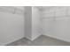 Walk-in closet with ample shelving space and neutral carpeting, offering lots of storage at 720 Raymond Dr, Clayton, NC 27527
