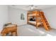 Bright bedroom with natural light highlighting the wooden bunkbed and play table at 730 N Harrison Ave, Cary, NC 27513