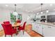 Charming dining area connected to an updated kitchen featuring a round table with red chairs at 730 N Harrison Ave, Cary, NC 27513