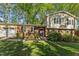 Charming two-story home with a well-maintained lawn, brick facade, and lush landscaping at 730 N Harrison Ave, Cary, NC 27513