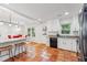 Bright kitchen with terracotta tile flooring, granite counters, and an open layout at 730 N Harrison Ave, Cary, NC 27513