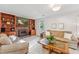 Inviting living room features a brick fireplace and built-in wooden shelving at 730 N Harrison Ave, Cary, NC 27513