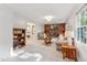 Comfortable living room with carpet, a fireplace, built-in shelves, and lots of natural light at 730 N Harrison Ave, Cary, NC 27513