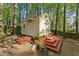 Charming backyard shed featuring a decorative door and a sturdy, functional ramp at 730 N Harrison Ave, Cary, NC 27513