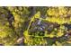 Aerial view of the property showcasing its sprawling lot, landscaping, and proximity to the lake at 775 Sagamore Dr, Louisburg, NC 27549