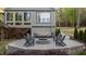 Backyard patio featuring a cozy fire pit and comfortable seating area at 775 Sagamore Dr, Louisburg, NC 27549