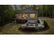 Inviting backyard with a patio, fire pit, and well-maintained landscaping, creating a serene outdoor retreat at 775 Sagamore Dr, Louisburg, NC 27549