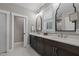 This bright bathroom features dual sinks, modern fixtures, and a separate toilet room at 775 Sagamore Dr, Louisburg, NC 27549