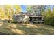 Craftsman style home featuring manicured lawn, landscaped beds and stone accents on porch at 775 Sagamore Dr, Louisburg, NC 27549