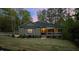Charming craftsman-style home with manicured lawn, stone accents, and inviting front porch at 775 Sagamore Dr, Louisburg, NC 27549