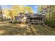Charming front yard with lush landscaping, stone accents, and covered porch on a sunny day at 775 Sagamore Dr, Louisburg, NC 27549