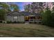 Charming single-story home featuring a covered porch and well-maintained landscaping at 775 Sagamore Dr, Louisburg, NC 27549