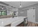 Open concept kitchen with large island, stainless steel dishwasher and farmhouse sink at 775 Sagamore Dr, Louisburg, NC 27549