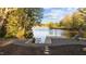 Beautiful lake view with a private dock, seating, and meticulously landscaped yard at 775 Sagamore Dr, Louisburg, NC 27549