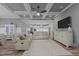 Spacious living room showcases coffered ceiling, fan and recessed lights, with seating and decor at 775 Sagamore Dr, Louisburg, NC 27549