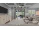 Living room featuring coffered ceiling, recessed lighting, and sliding glass doors to a covered porch at 775 Sagamore Dr, Louisburg, NC 27549