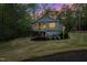 Beautiful home with a deck, patio, lush landscaping and a fire pit, perfect for entertaining at 775 Sagamore Dr, Louisburg, NC 27549