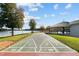 Recreational area featuring a shuffleboard court with a pavilion and picturesque lake views, perfect for outdoor fun at 775 Sagamore Dr, Louisburg, NC 27549