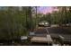 Waterfront property featuring a private dock, stone pathway, and landscaped grounds leading to a charming home at 775 Sagamore Dr, Louisburg, NC 27549
