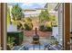 Outdoor patio area features seating, fire pit, and privacy fence at 7822 Allscott Way, Raleigh, NC 27612
