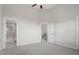 Spacious bedroom features neutral colors, ceiling fan, and ensuite bathroom at 7822 Allscott Way, Raleigh, NC 27612