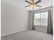 Bedroom with large window offers natural light and neutral decor at 7822 Allscott Way, Raleigh, NC 27612