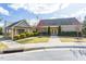 Well-manicured community clubhouse featuring charming landscaping, bright walkways, and a convenient mailbox station at 7822 Allscott Way, Raleigh, NC 27612