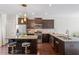 The beautiful kitchen boasts granite countertops, stainless appliances, and dark wood cabinetry at 7822 Allscott Way, Raleigh, NC 27612