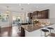 Open concept kitchen with stainless steel appliances, granite countertops, and bar stool seating at 7822 Allscott Way, Raleigh, NC 27612