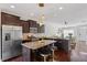 Open concept kitchen with stainless steel appliances, granite countertops, and bar stool seating at 7822 Allscott Way, Raleigh, NC 27612