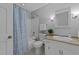 Bathroom with a vanity sink, tiled shower, and a neutral, minimalist design at 801 Silver Leaf Pl, Raleigh, NC 27609