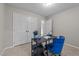 Bedroom with desk, carpet, and double closets, offering functionality and storage at 801 Silver Leaf Pl, Raleigh, NC 27609