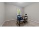 Small bedroom with a desk, chair and window with lots of light and neutral carpeting at 801 Silver Leaf Pl, Raleigh, NC 27609