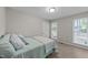 Bedroom with carpet floors, a bed and lots of natural light from the windows at 801 Silver Leaf Pl, Raleigh, NC 27609