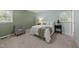 Cozy bedroom with natural light, a comfortable bed, and a calming color scheme at 801 Silver Leaf Pl, Raleigh, NC 27609