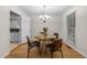 Cozy dining room with modern chandelier and hardwood floors at 801 Silver Leaf Pl, Raleigh, NC 27609