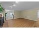 Open living room with hardwood floors, neutral walls, and direct access to the kitchen at 801 Silver Leaf Pl, Raleigh, NC 27609