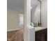 Chic powder room with a stylish vanity, granite countertop, and a decorative mirror at 801 Silver Leaf Pl, Raleigh, NC 27609