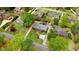 Aerial view of a well-maintained home with a manicured lawn, brick house and mature trees at 806 S Second St, Smithfield, NC 27577