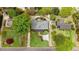 Aerial view of a well-maintained home with a manicured lawn and mature trees at 806 S Second St, Smithfield, NC 27577