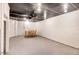 Spacious basement featuring a dining area, white-painted brick walls, and a black ceiling at 806 S Second St, Smithfield, NC 27577