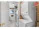 Bathroom with shower, toilet, laundry area and patterned wallpaper at 806 S Second St, Smithfield, NC 27577